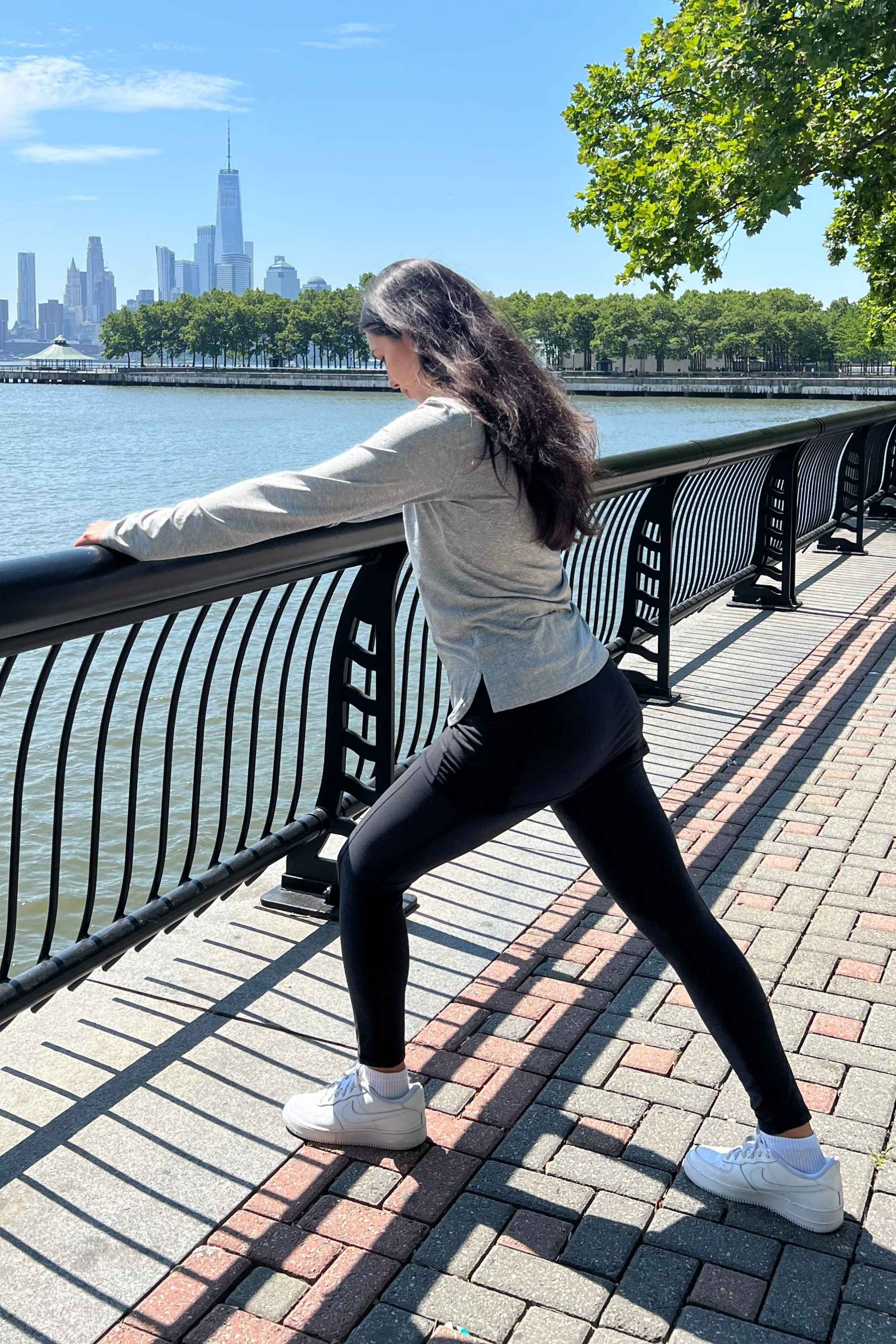 Black ankle length skirted leggings modeled by woman