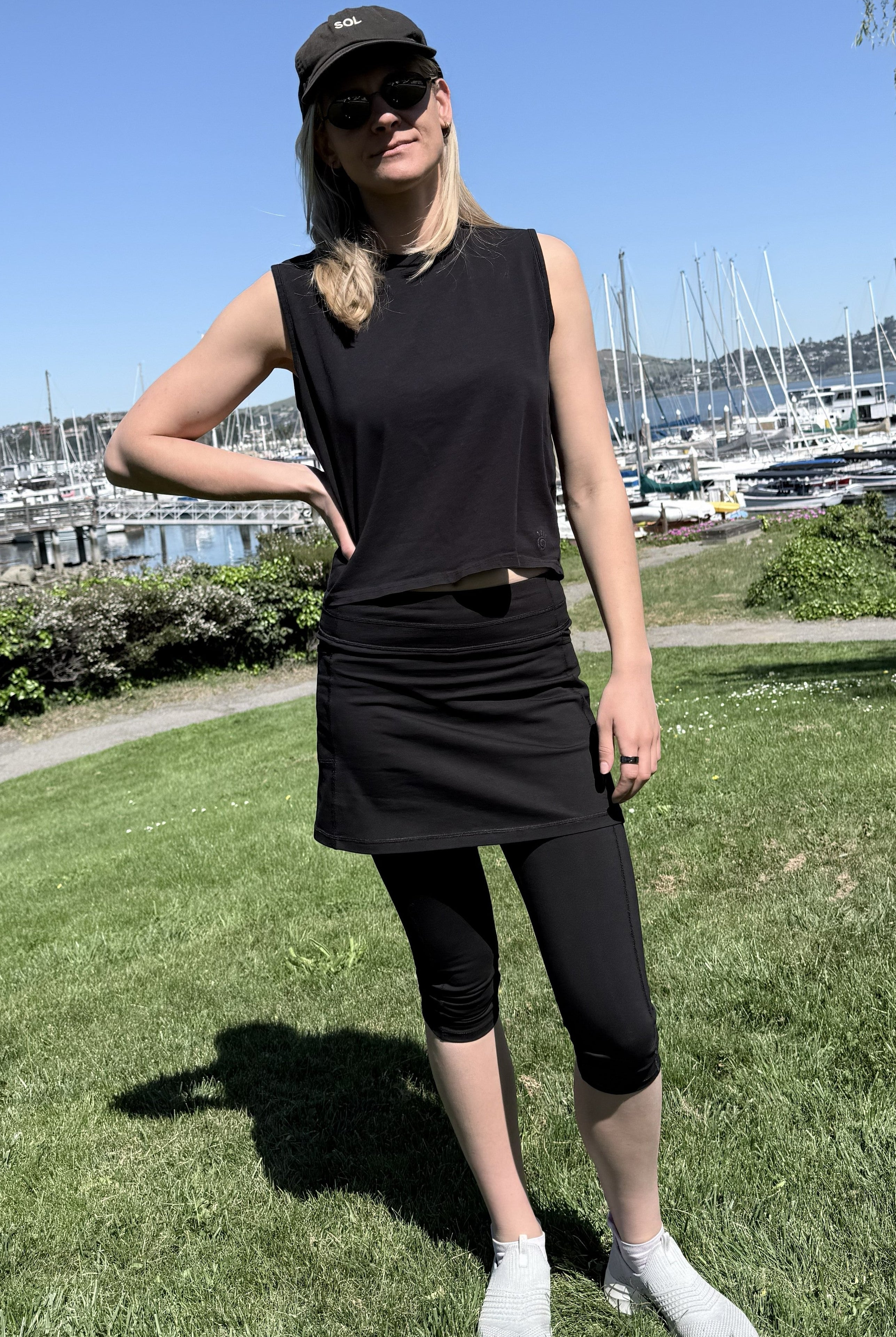 Model wearing Black Cotton Capris Leggings near harbor