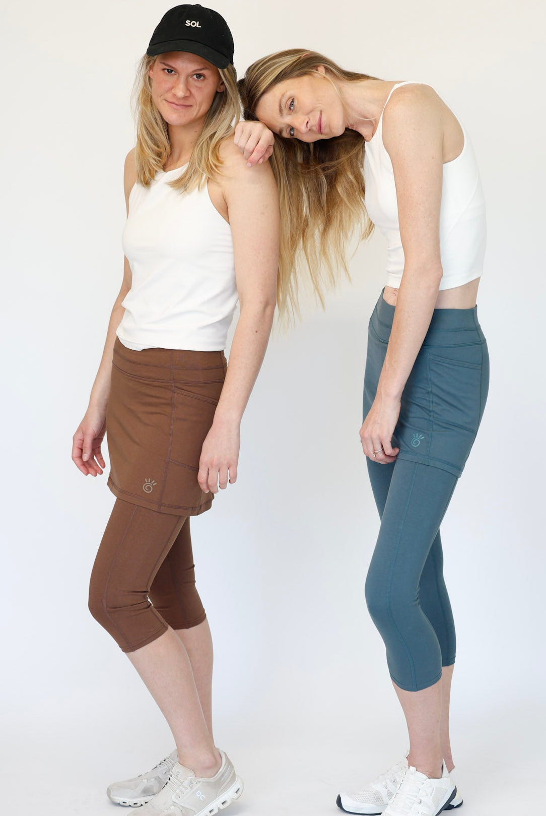 Two women wearing Brown and Blue Cotton Leggings in studio