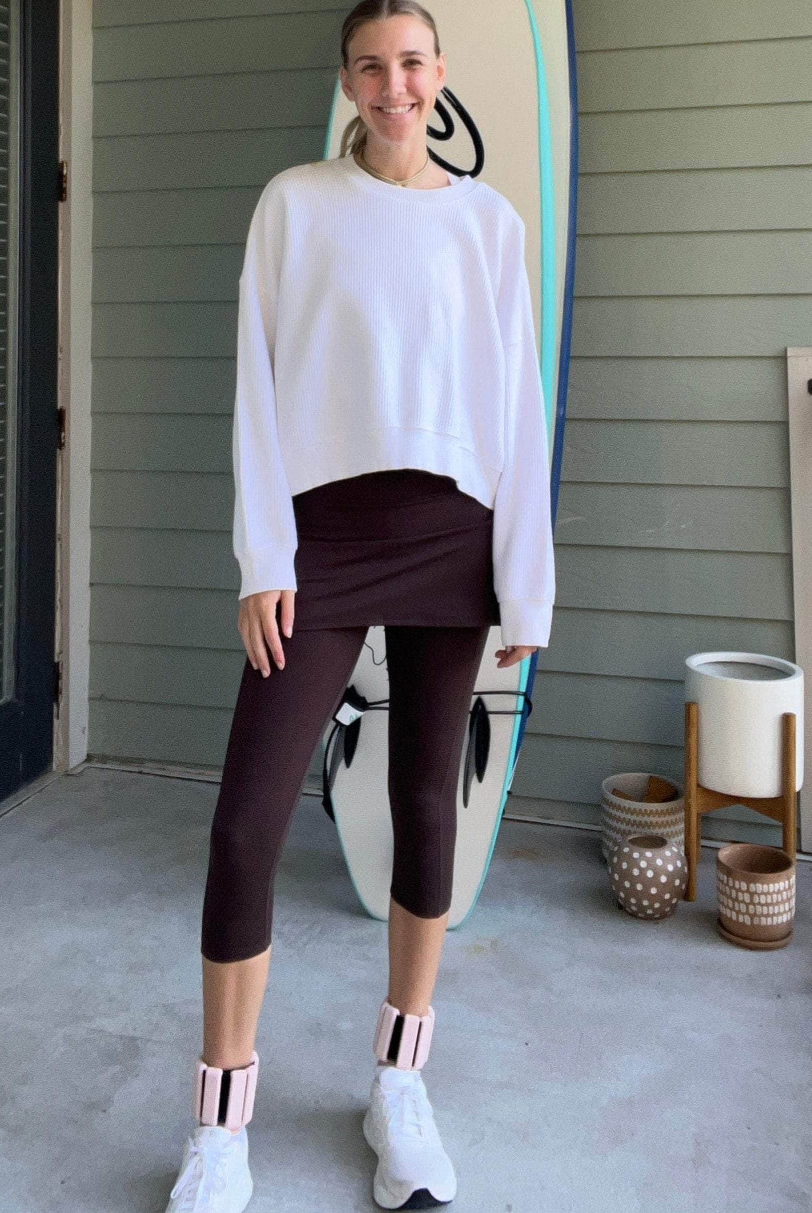 Shot of model on porch wearing Espresso Brown 2-1 Skirted Ankle-Length Leggings from front angle