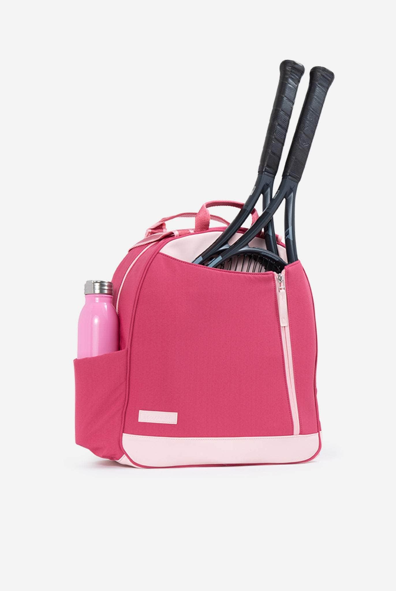 Pink tennis backpack with two racquets sticking out.