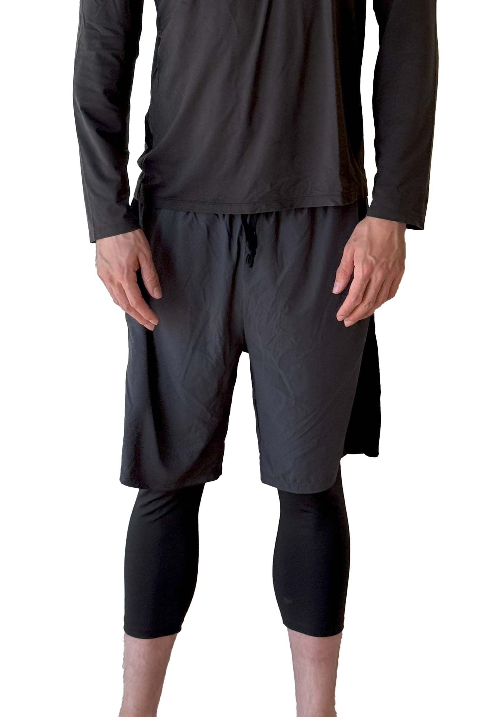 Male model wearing Sol Sister Mister Men's 2-1 Shorts with Midcalf length Leggings taken chest down from front.