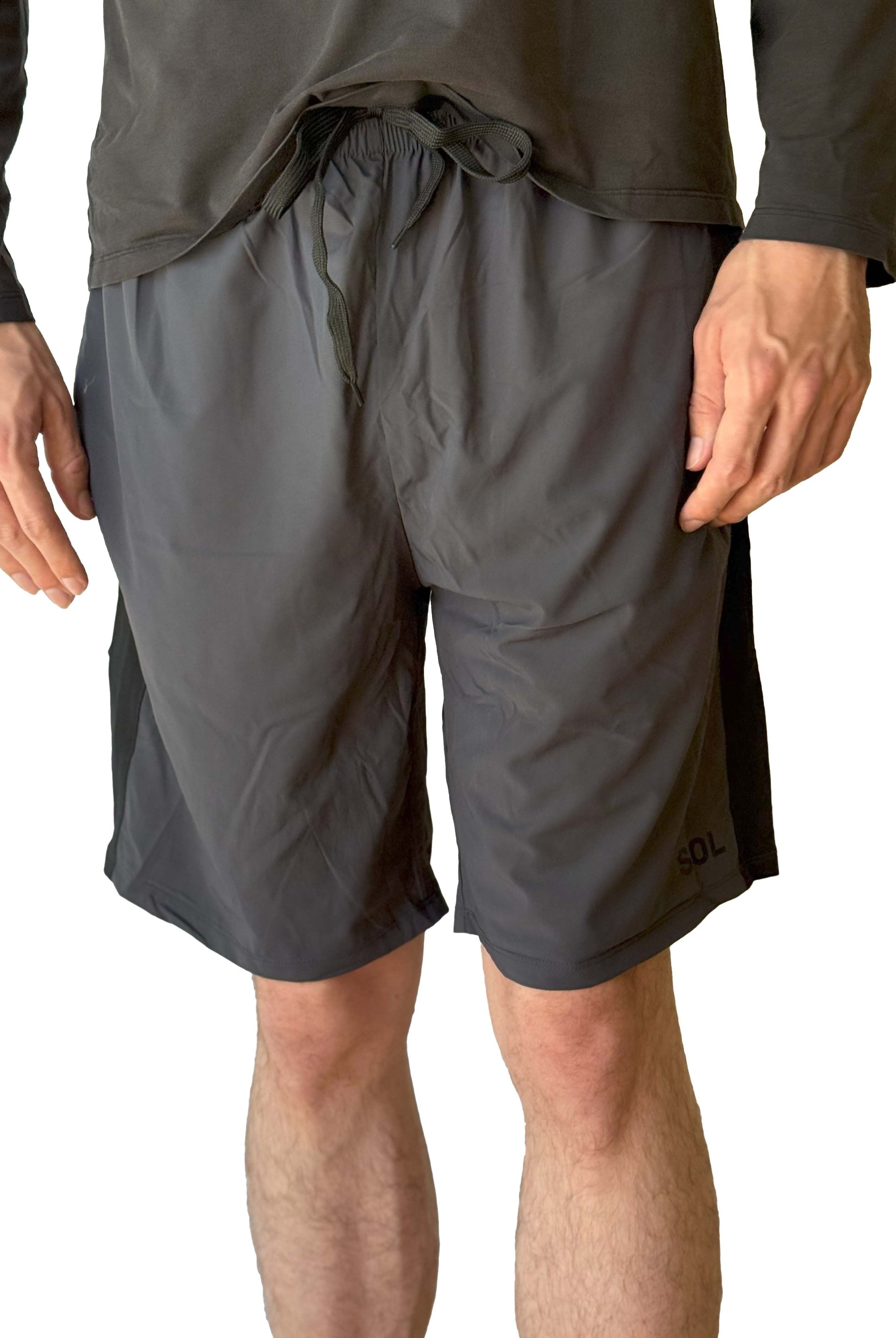 Male model wearing Sol Sister Mister Men's 2-1 Shorts with Leggings taken cropped from torso to shins from front.