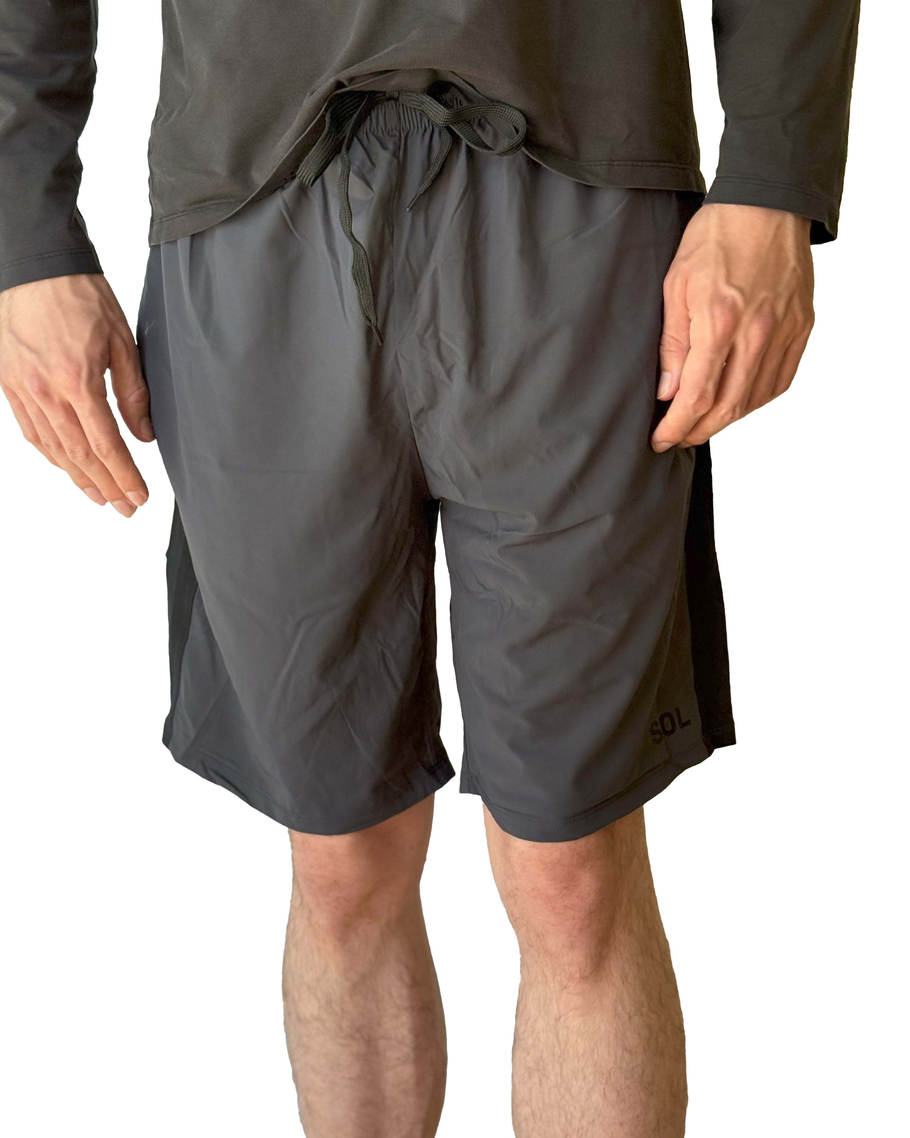 Male model wearing Sol Sister Mister Men's 2-1 Shorts with Leggings taken cropped from torso to shins from front.