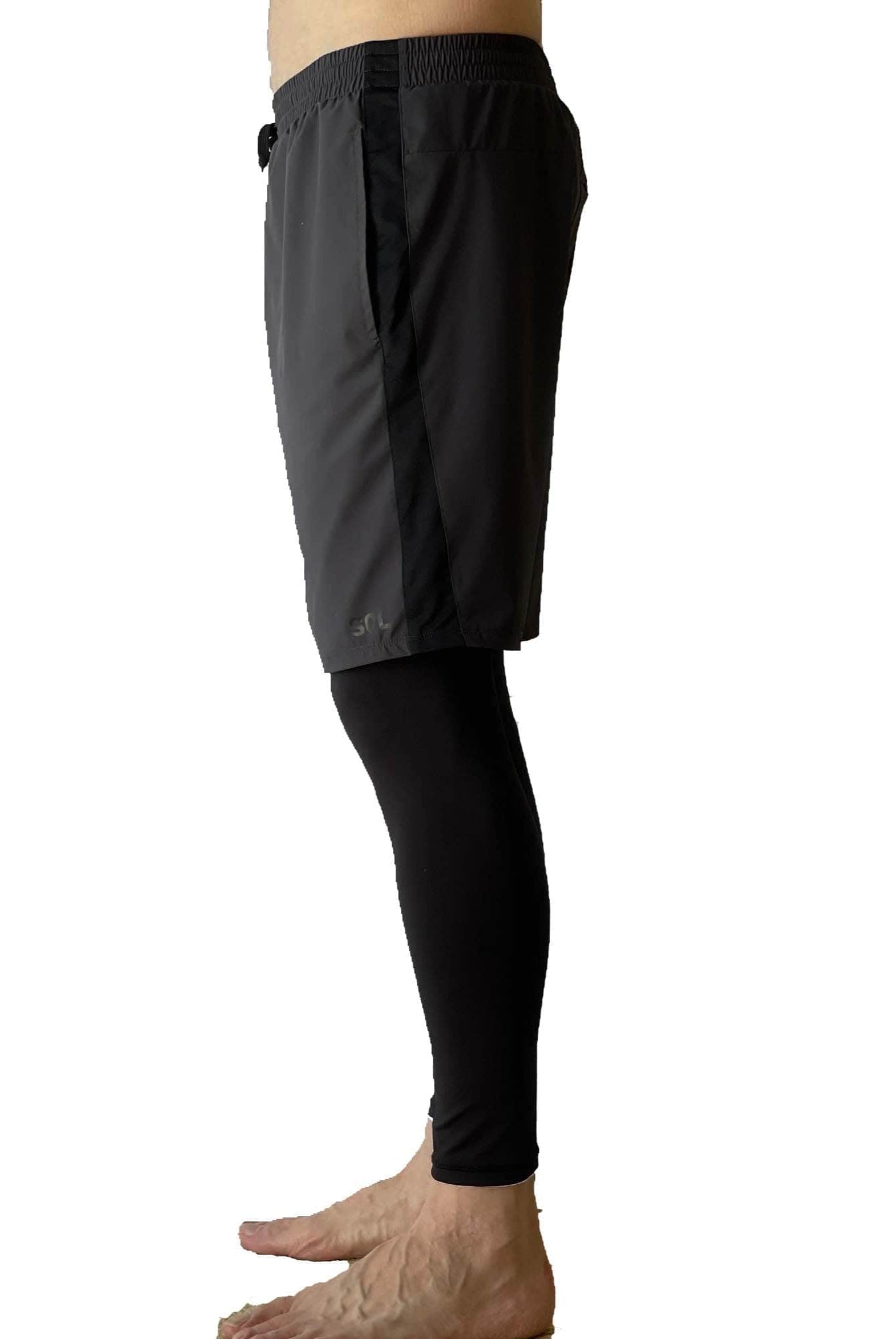 Male model wearing Sol Sister Mister Men's 2-1 Shorts with Leggings taken waist down from side.