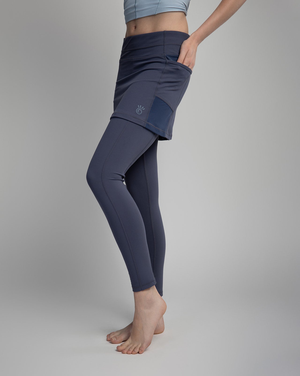 Studio shot of model wearing 2-1 Nordic Dusk colored Ankle-Length Skirted Leggings - Sol Sister Sport