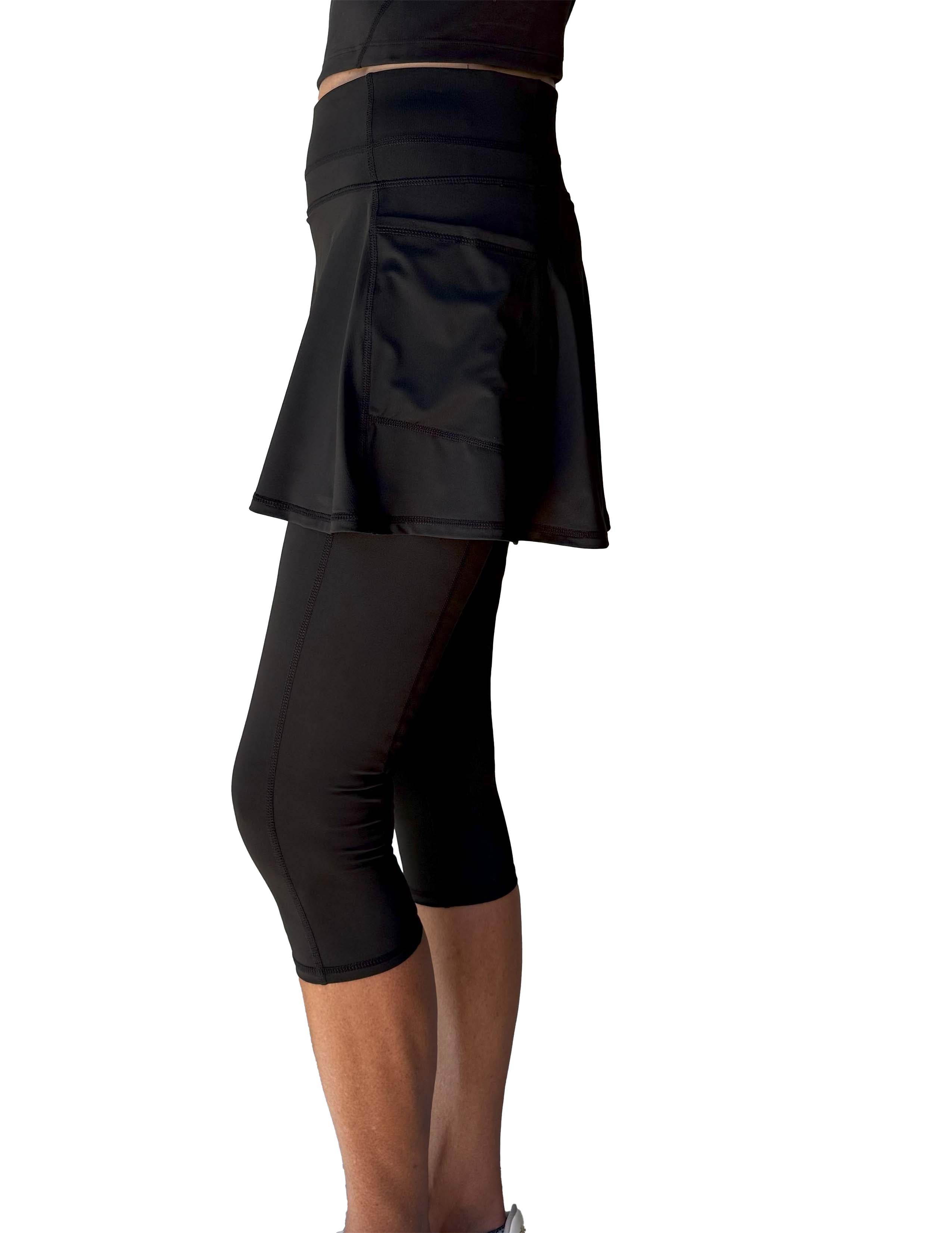 Black athletic skirted capris length leggings set on a white background from the side