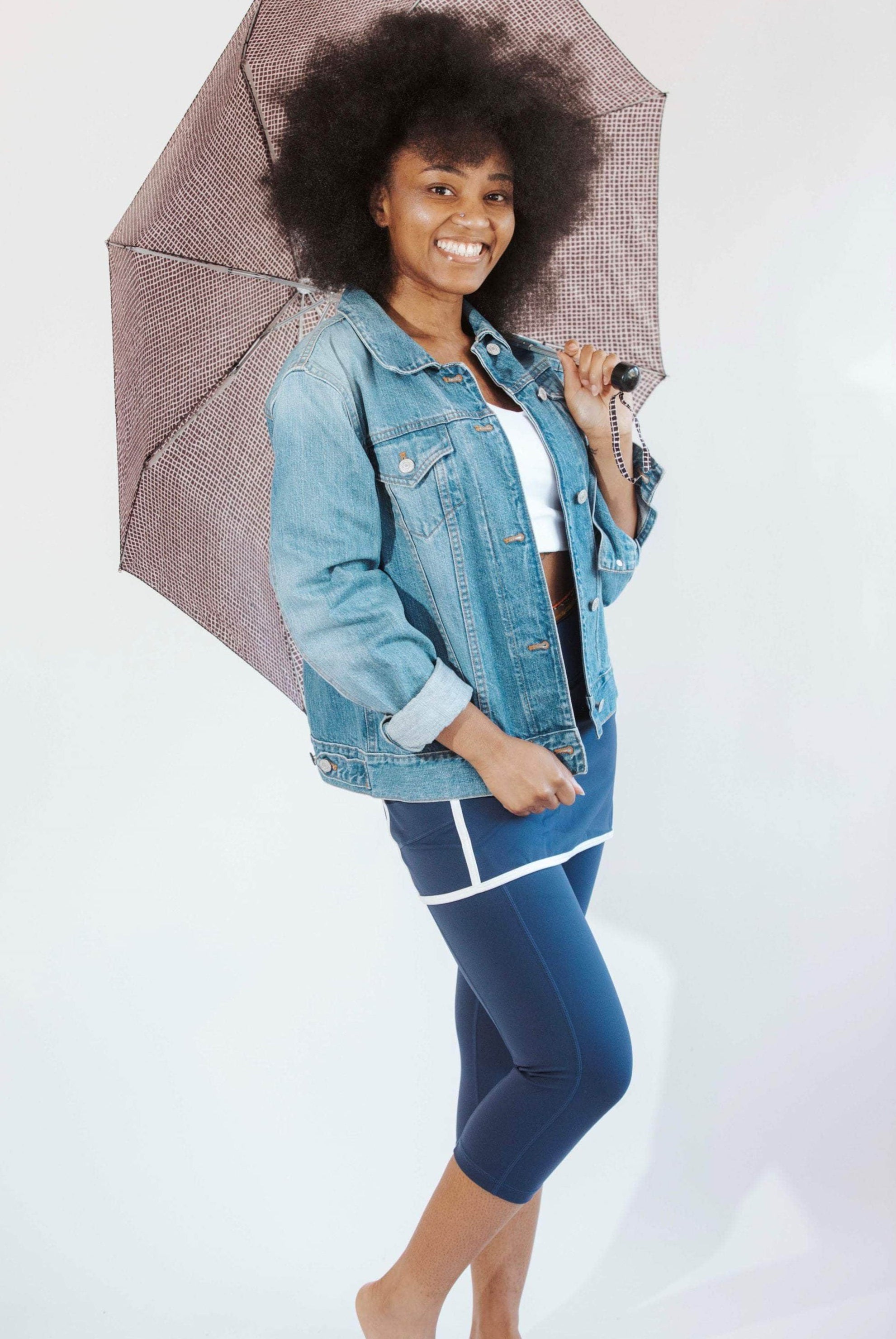Pretty model wearing navy skirted leggings with white piping on skirt