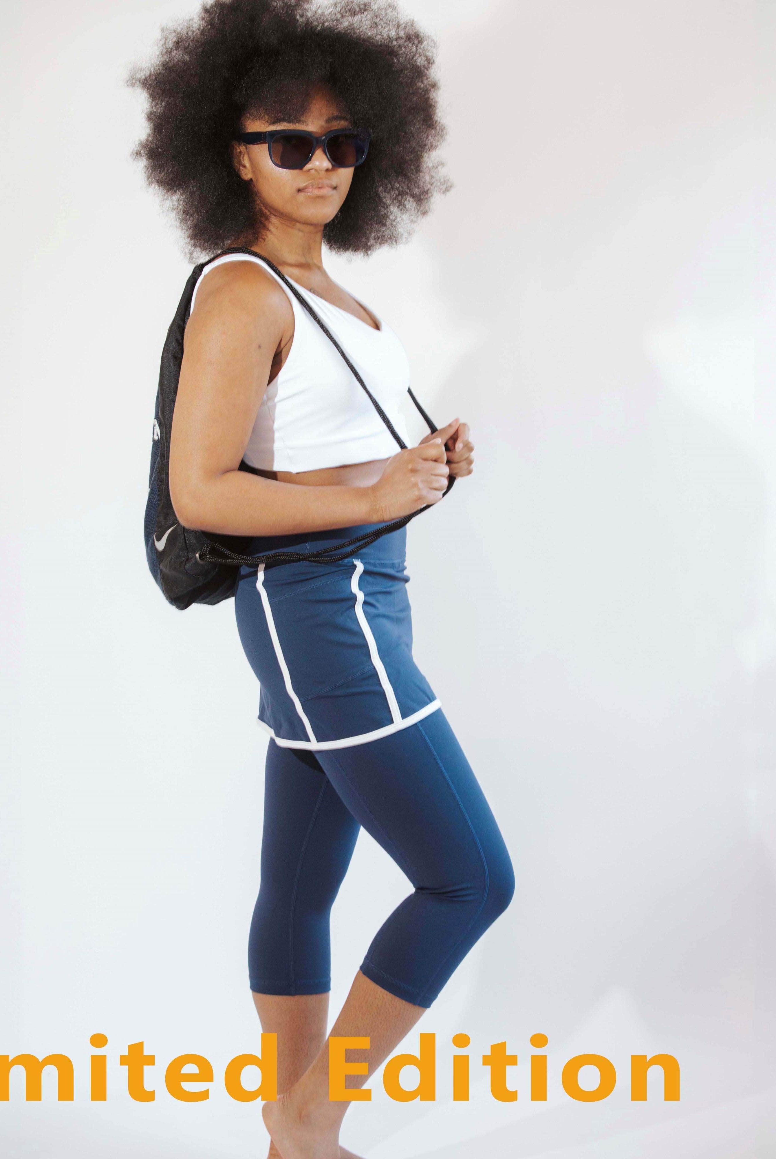 Model wearing navy skirted leggings with white piping on skirt - Retro and cool photo.