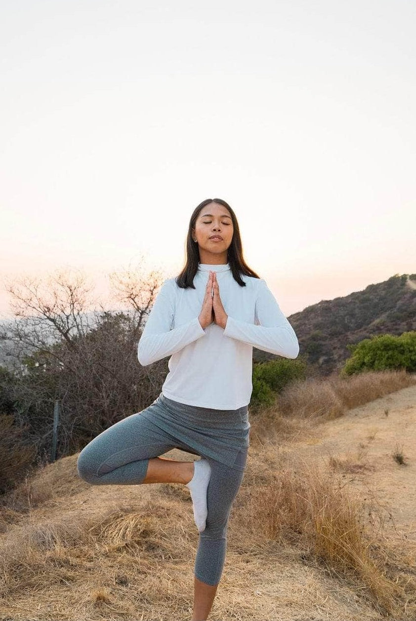 2-1 Original Skirted Mid-Calf Length Leggings in Heather Gray - Model is in the desert striking a yoga pose at sunset - Sol Sister Sport