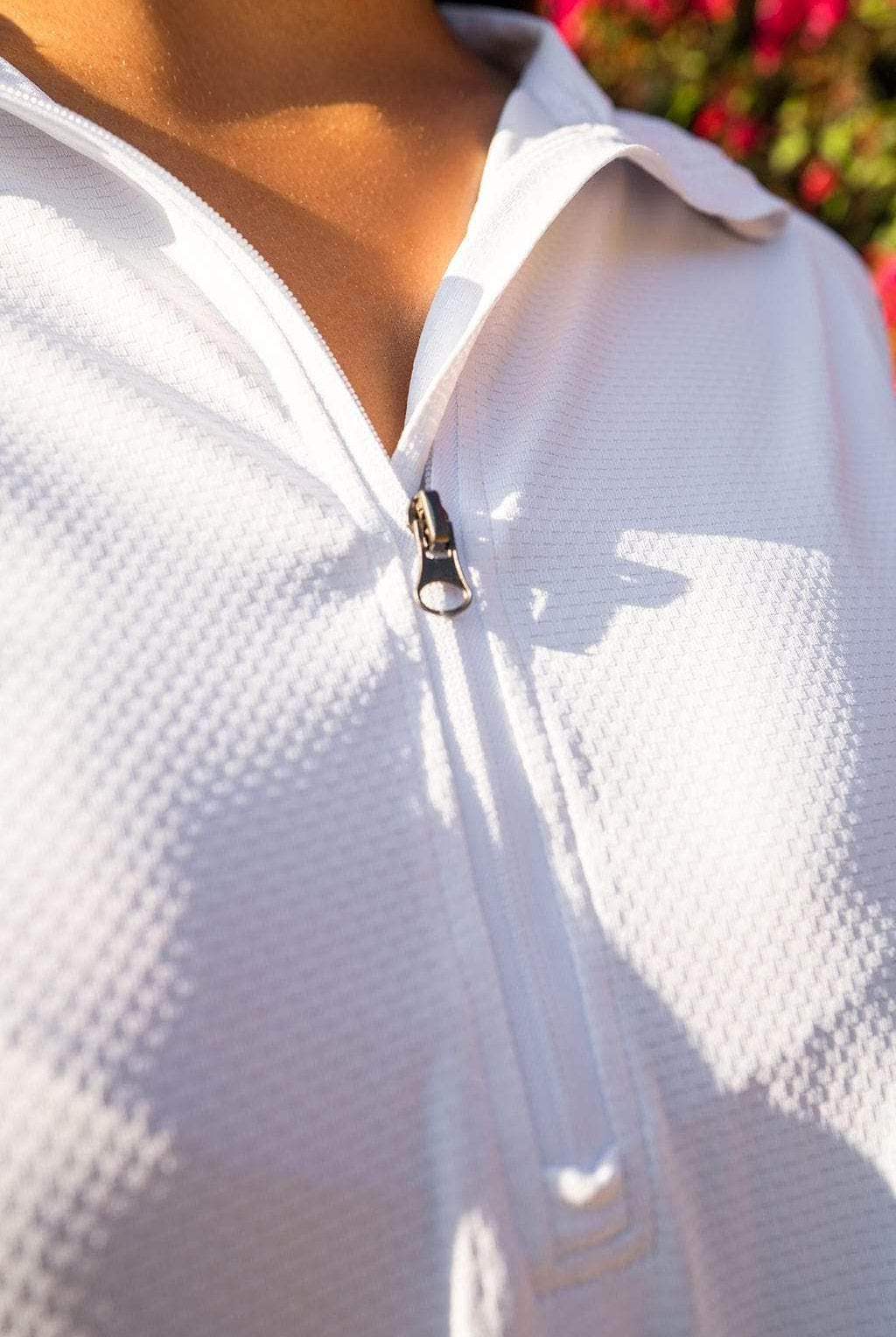 Close up shot of a Lightweight, moisture wicking, 1/4 zip white Long-sleeve shirt - Sol Sister Sport