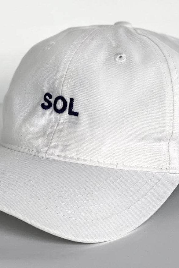White Cap with letters SOL on it - Sol Sister Sport