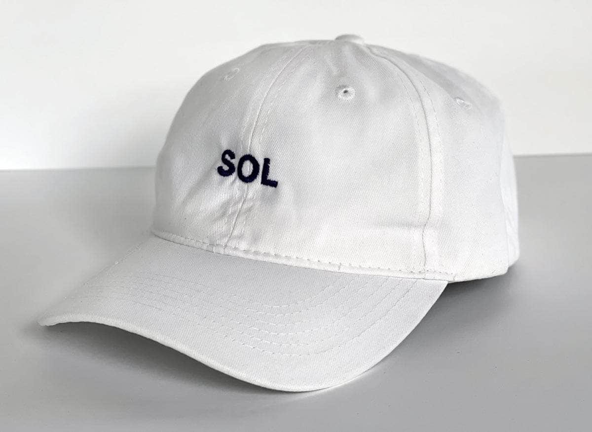 White Cap with letters SOL on it - Sol Sister Sport