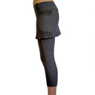 Studio shot of model from waist down in 2-1 Original Skirted Mid-calf Length Leggings in Steel from side