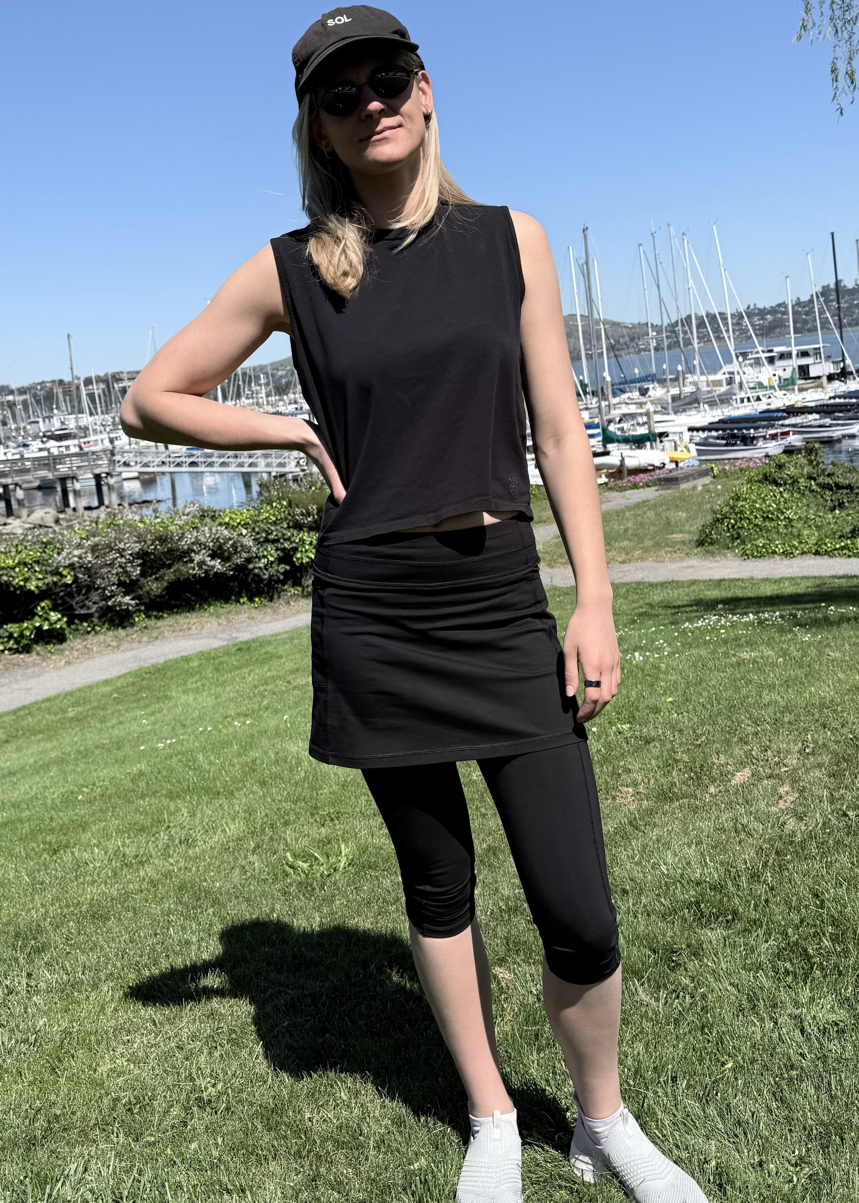 Model wearing Black Cotton Capris Leggings near harbor