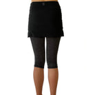 One piece black skirt with heather grey capris length leggings.   Photo shows waist down shot of model wearing them from the back.