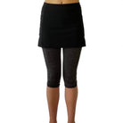 One piece black skirt with heather grey capris length leggings.   Photo shows waist down shot of model wearing them from the front.