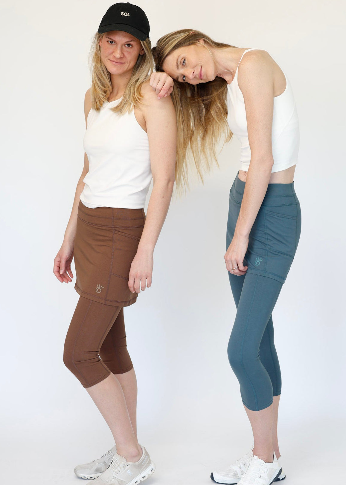 Two women wearing Brown and Blue Cotton Leggings in studio