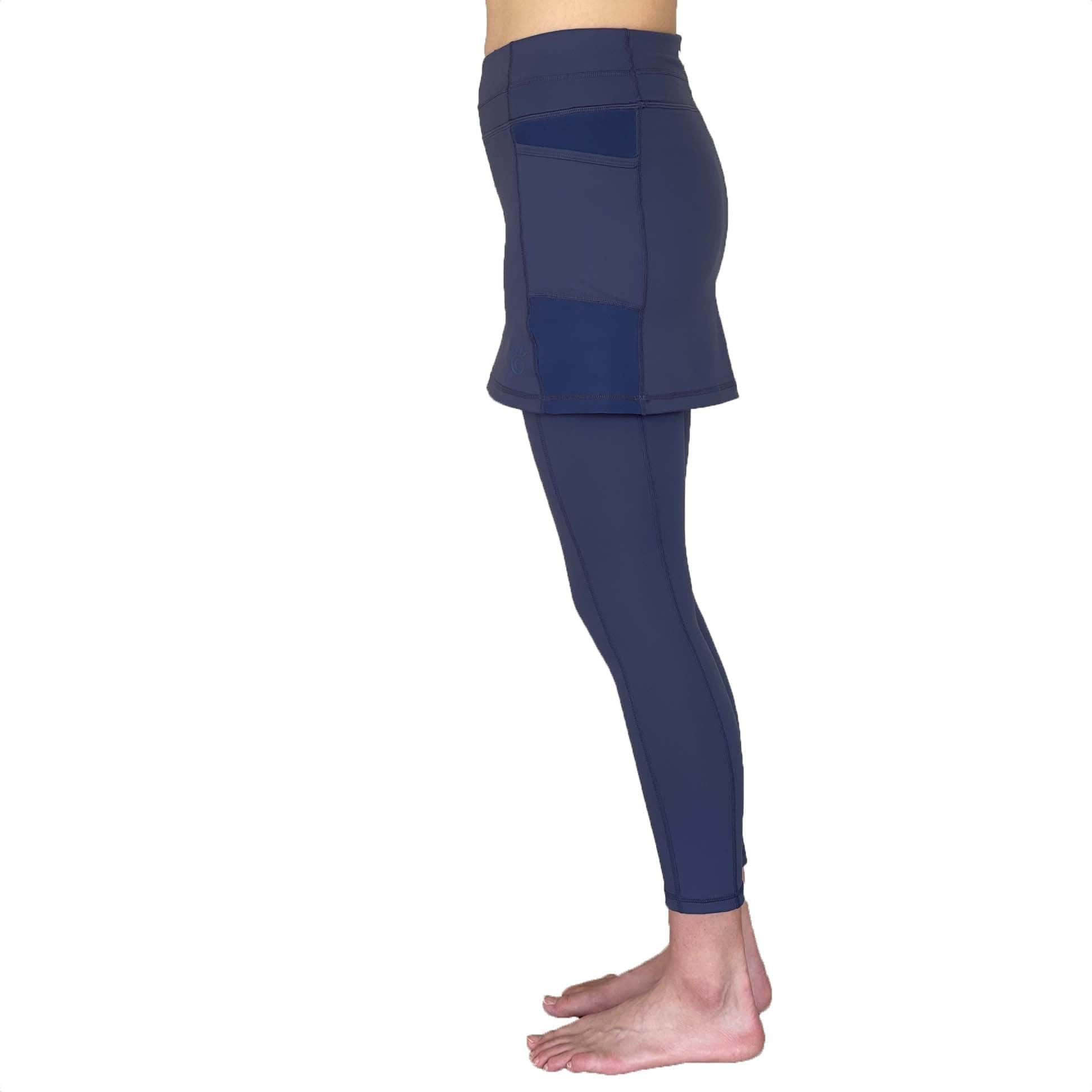 Studio shot of model wearing 2-1 Nordic Dusk colored Ankle-Length Skirted Leggings - Waist down from side view.