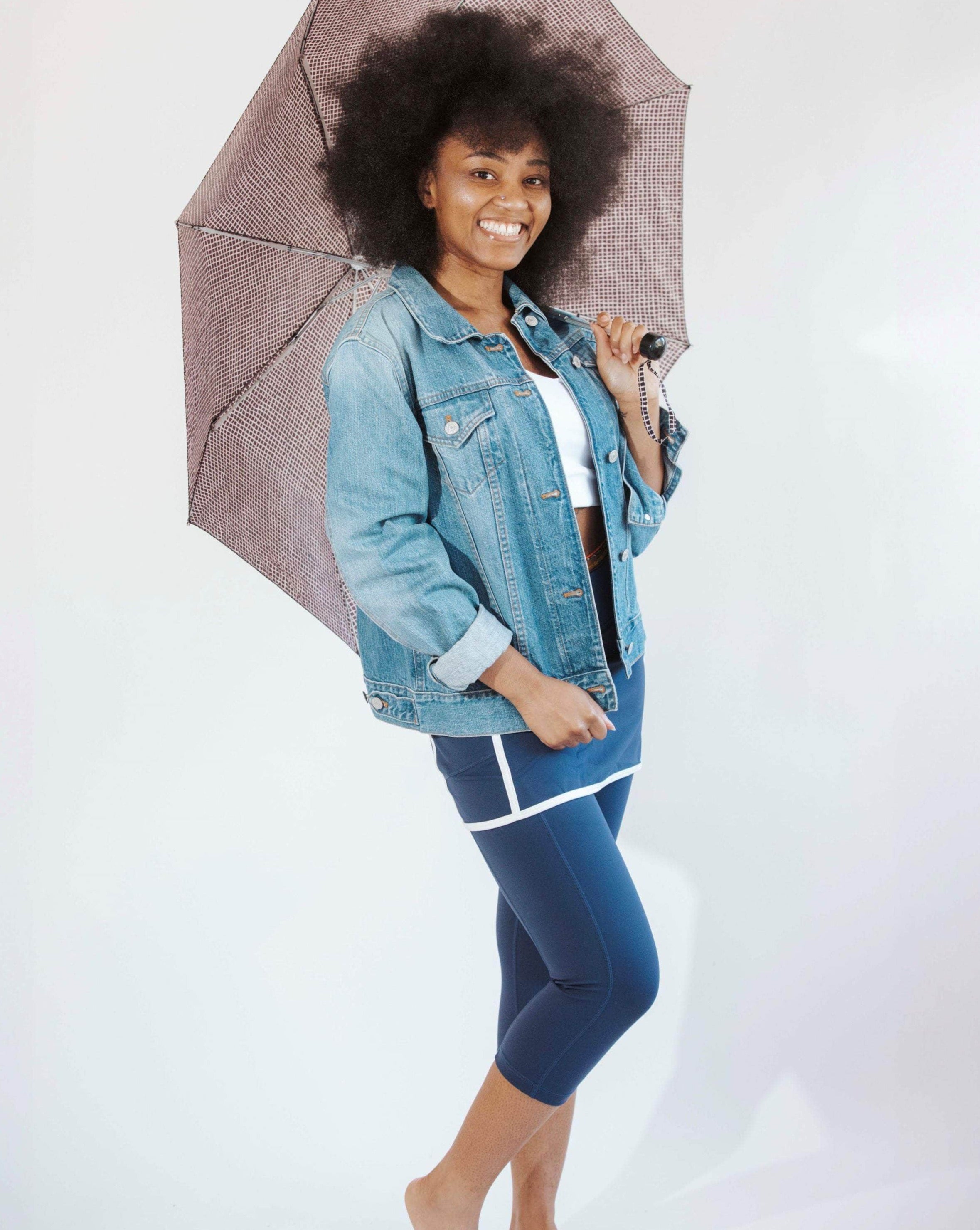 Pretty model wearing navy skirted leggings with white piping on skirt