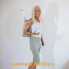 Pretty model wearing sage green skirted leggings with white shirt