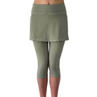 Studio shot waist down of model wearing sage green skirted leggings  from front.