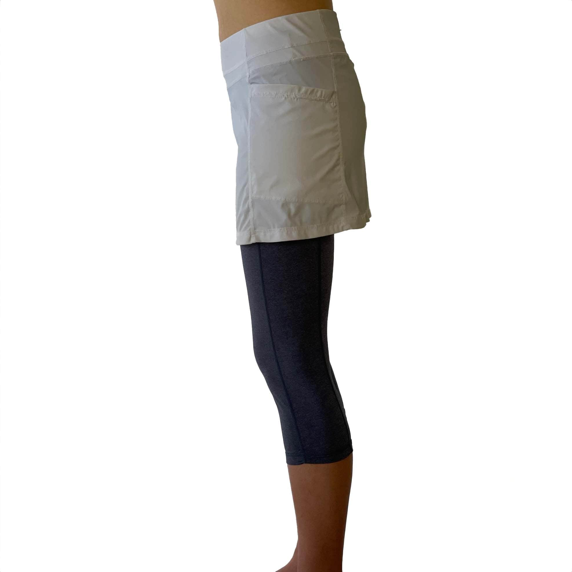 Waist down from side photo of 2-1 Skort Capris Leggings - Leggings are heather blue and attached skirt is white nylon.