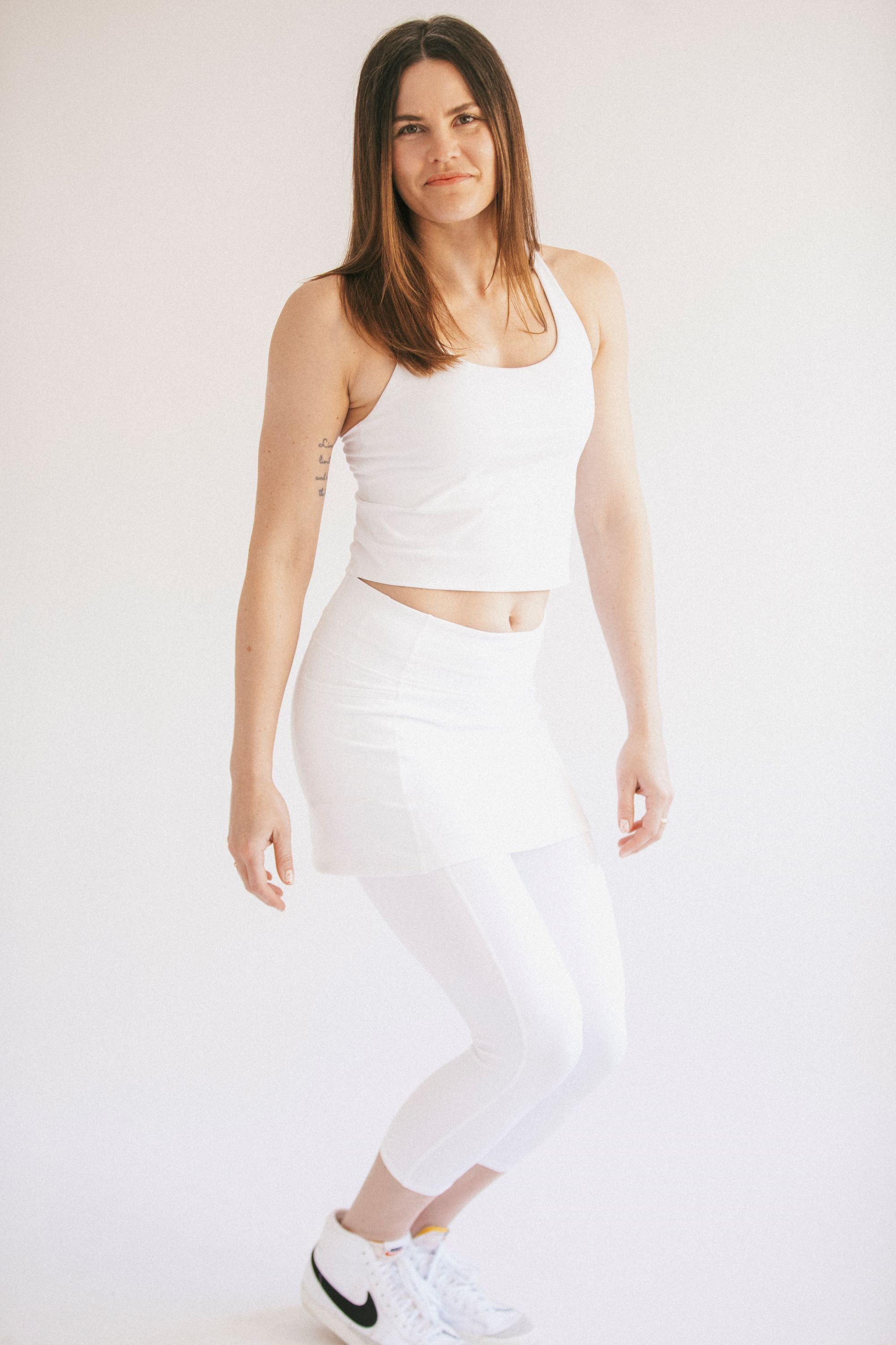 White tennis skirt with leggings and ball pockets