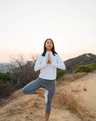 2-1 Original Skirted Mid-Calf Length Leggings in Heather Gray - Model is in the desert striking a yoga pose at sunset - Sol Sister Sport