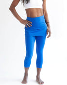 Studio shot of model wearing a pair of pretty bright blue water activity skirted leggings - Sol Sister Sport - Surf and Turf Water Activity leggings